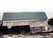in this picture you can see the difference a new steel barn roof makes to your appearance and longevity of your barn